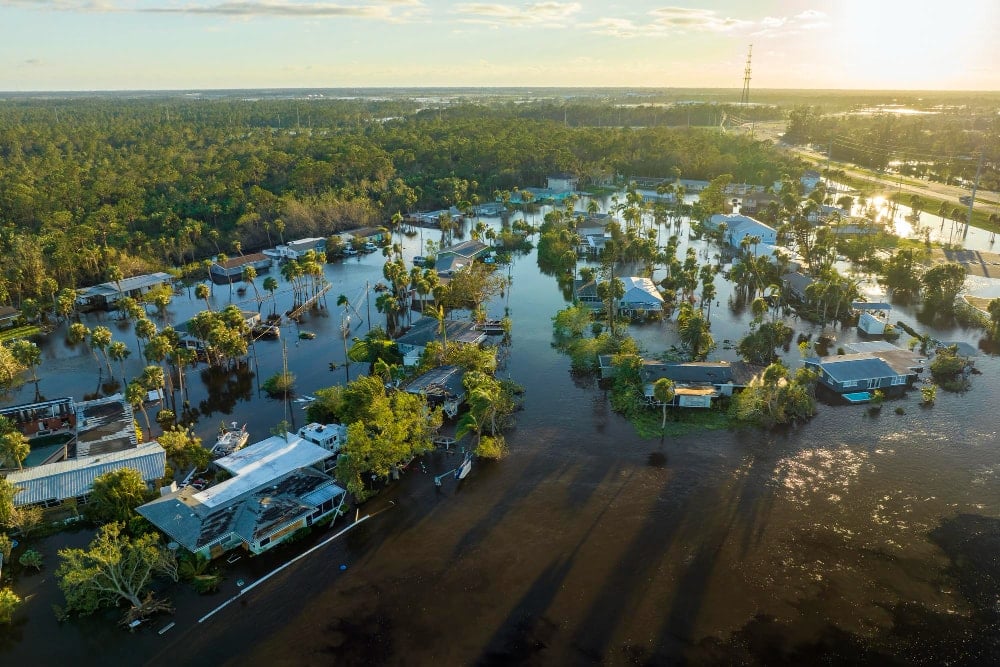Flooded houses by hurricane Ian in florida residential area and the recovery procedures must begin.